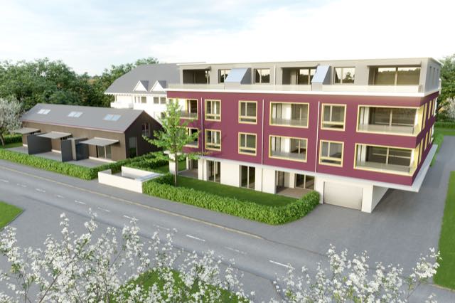 Mehrfamilienhaus mit farbiger Fassade und Dachterrassen